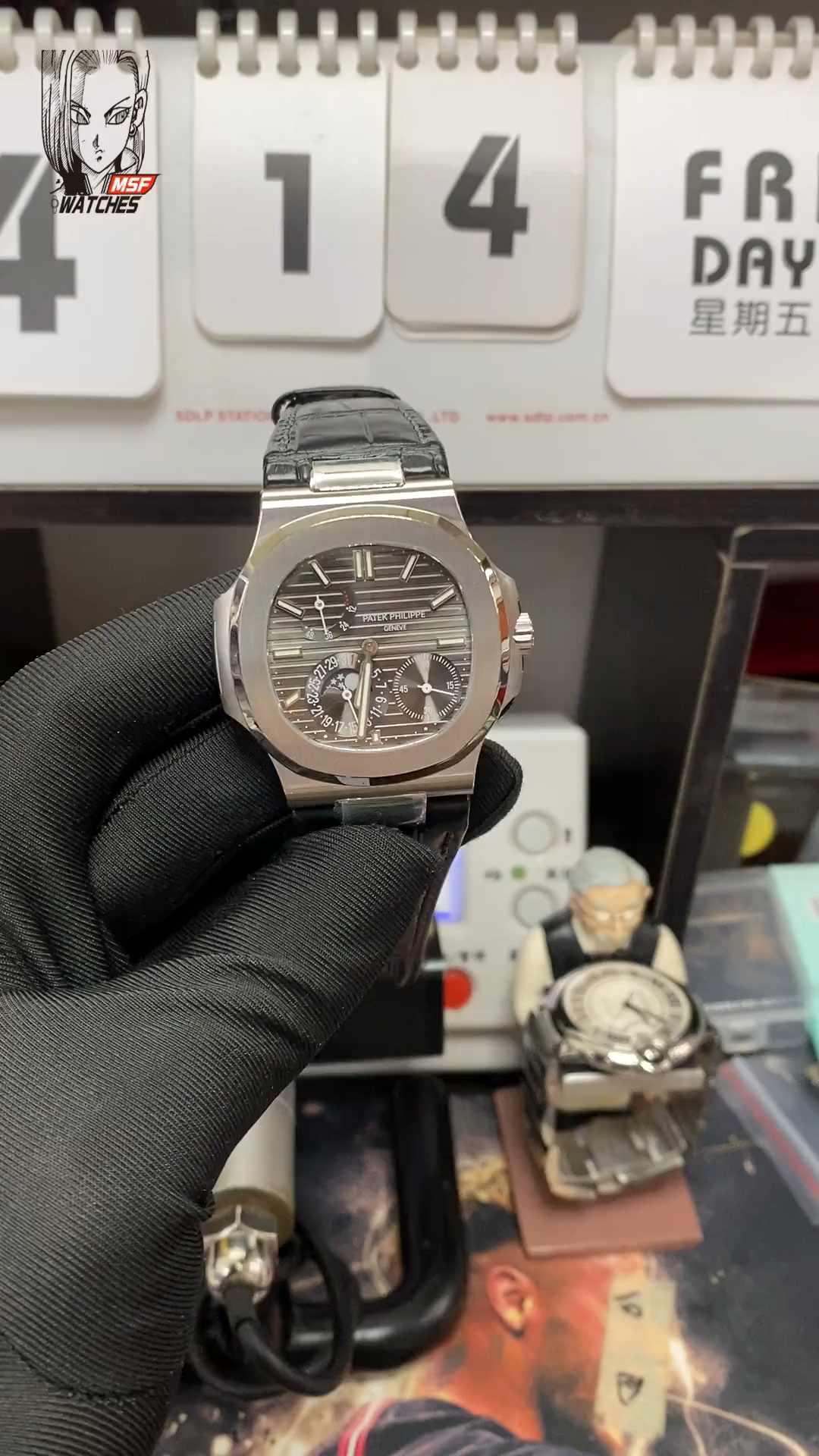 Patek Philippe Nautilus series 5712G-001, Stainless Steel Case Grey Dial Black Leather Strap, 40mm size.