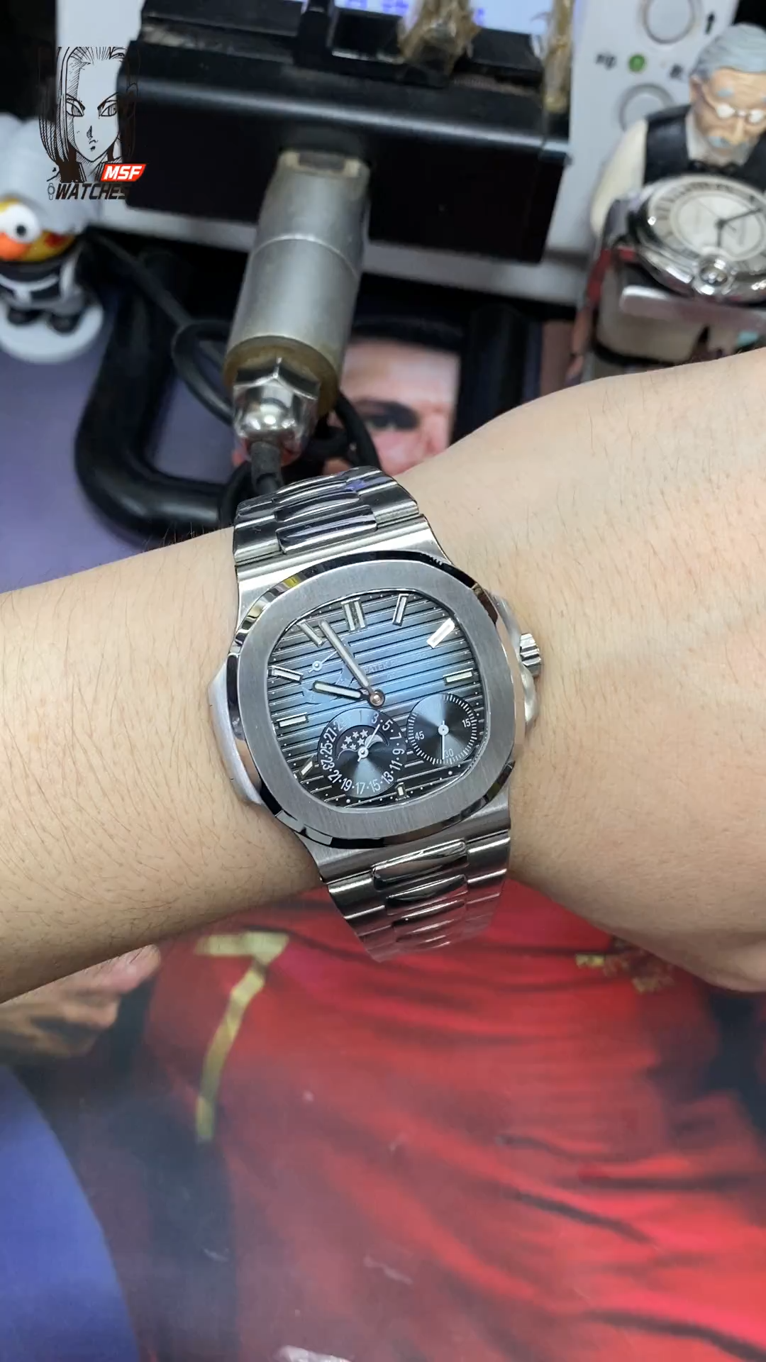 Patek Philippe Nautilus series 57121A-001, Blue Dial Steel Bracelet, Synchronized Functions, 40mm size.