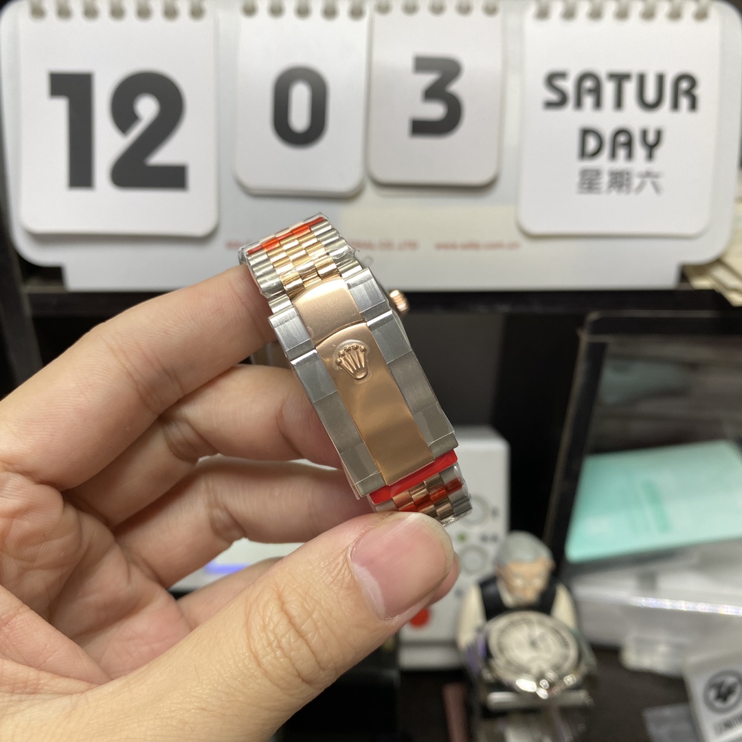 Rolex Datejust Series m126331-0008, Pink Dial with Checkered Bezel Two-Tone Rose Gold Case, 36mm Size, Five-Link Steel Bracelet.